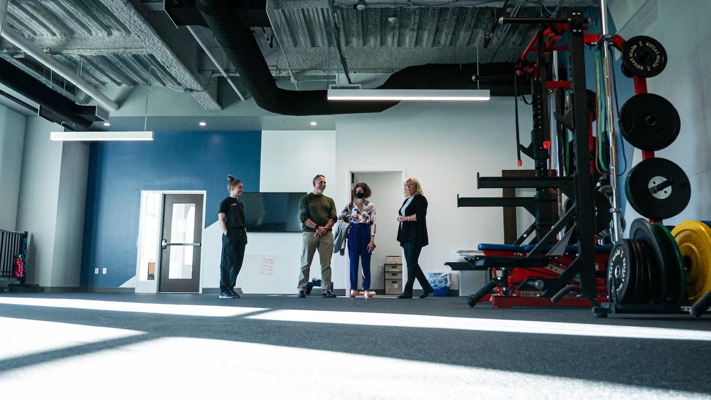 People stand inside a fitness space in Shenandoah University's new Wilkins Health & Fitness Suite.